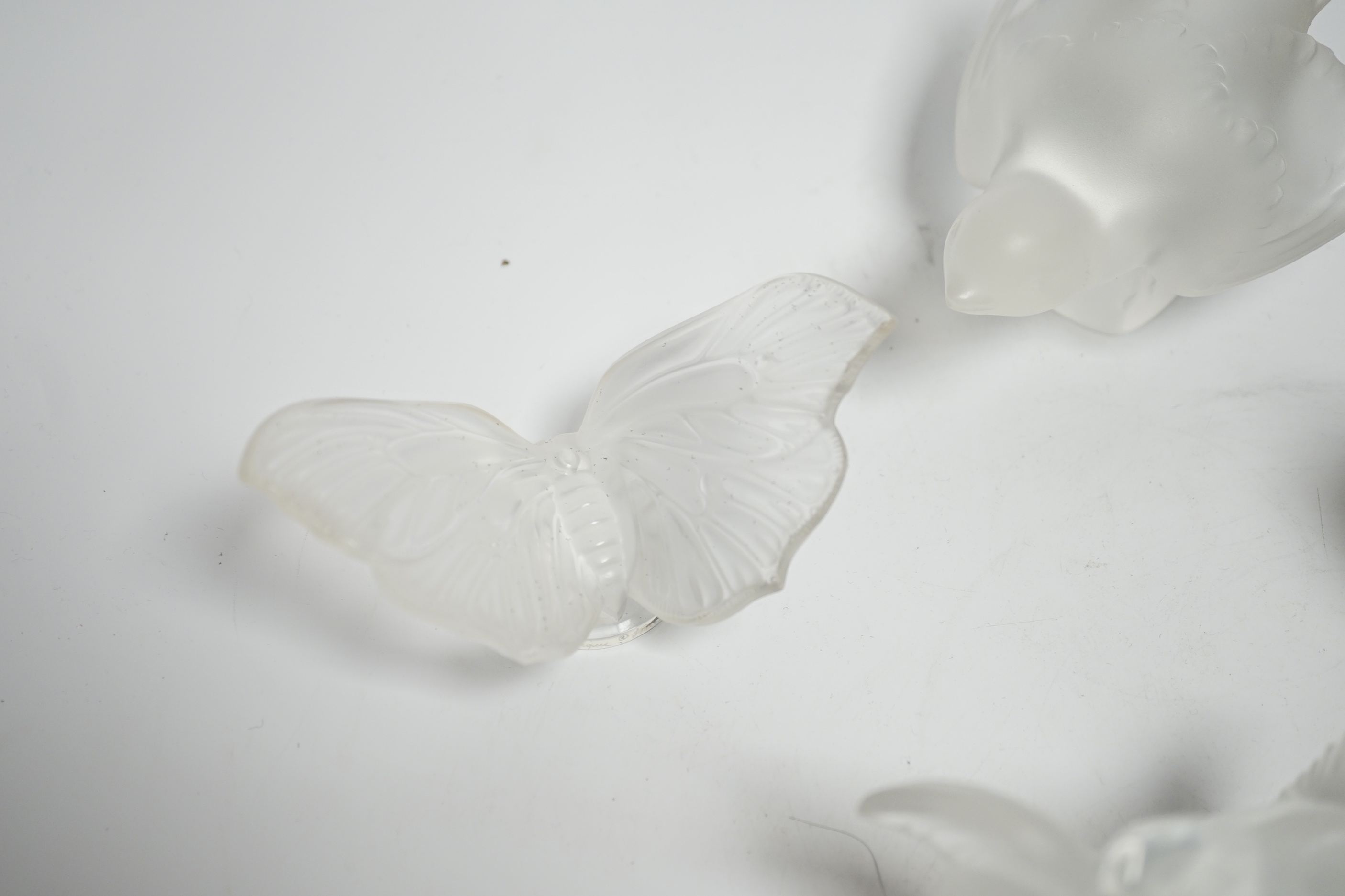 Four Lalique glass paperweights, three boxed